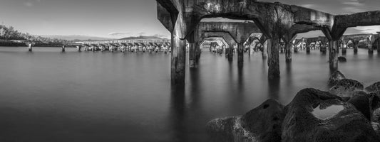 Black and white photo of the abandoned Ahukini Pier in Lihue, Kauai. Fine art photograph by Inspiring Images Hawaii Photography.