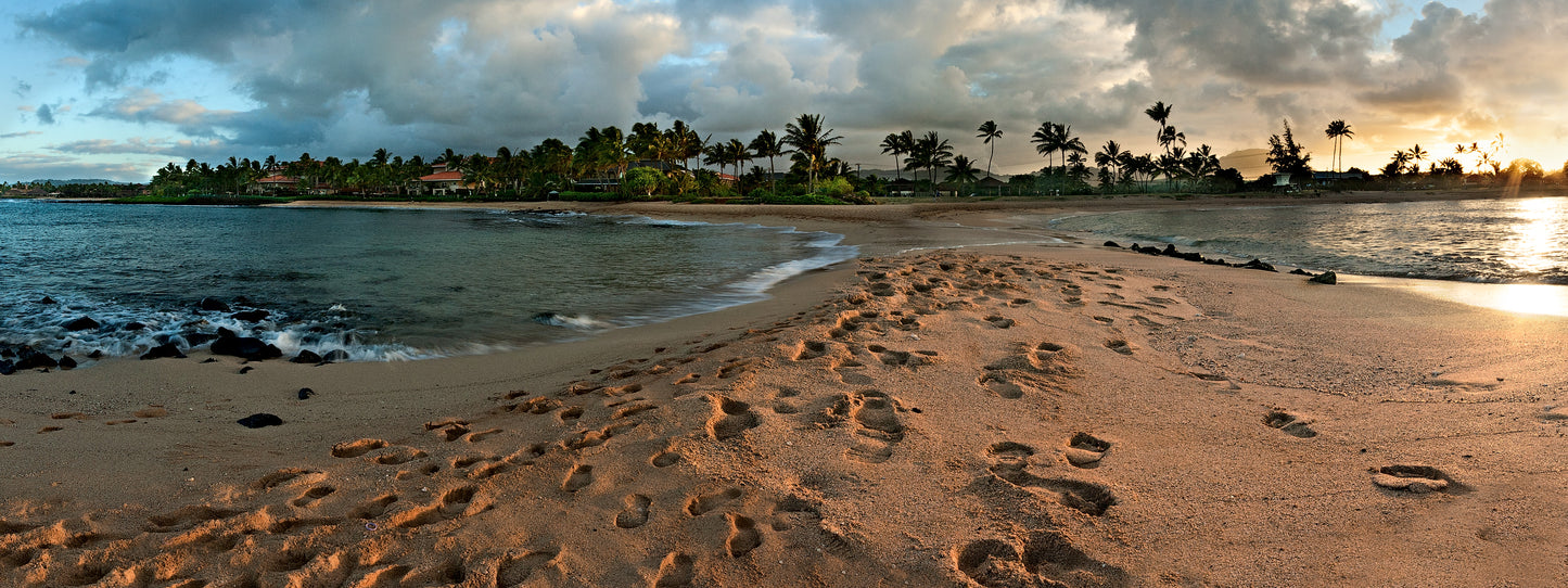 Fine art photograph taken from Kauai’s Poipu Beach tombolo. The beach glows just before sunset in this photograph by outdoor and landscape photographers Inspiring Images Hawaii.