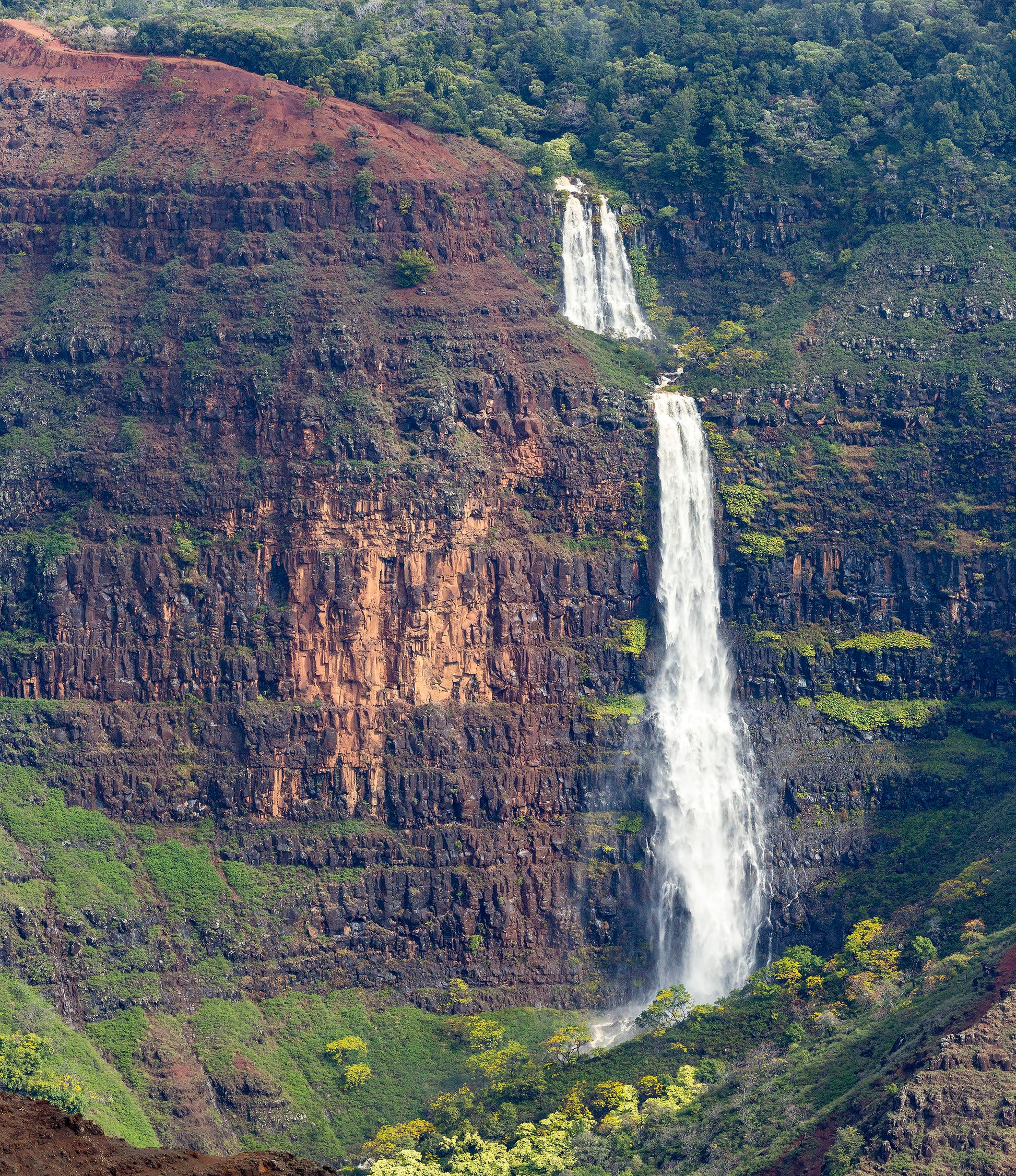 Fine art landscape photograph of Kauai’s Waipo’o Falls. Kauai nature and outdoor photography by Inspiring Images Hawaii.